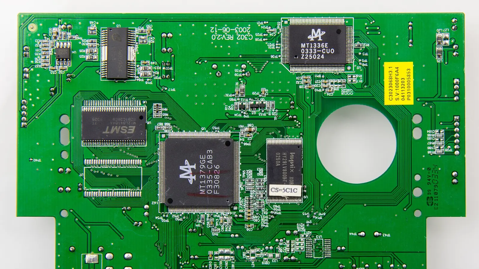 Green printed circuit board with chips, solder joints and copper traces